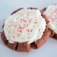 Red Velvet Cookie · A soft, warm red velvet chocolate cookie, topped with a white cream cheese frosting and pink...