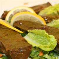 Grape Leaves · Hand rolled grape leaves, stuffed with rice, tomatoes, onions, simmered in lemon juice and o...