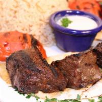 Beef Kabob Entree · Marinated filet mignon pieces grilled to perfection, served with rice and grilled vegetables.