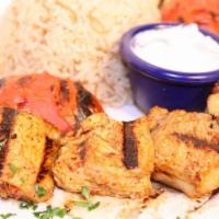 Chicken Kabob Entree · Marinated pieces of chicken breast grilled to perfection, served with rice and grilled veget...