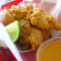 Fried Conch by Weight · Served with fries and coleslaw.