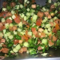 13. Sheperds Salad · Diced tomatoes, cucumber, green bell peppers, onions, parsley, lemon juice and olive oil.