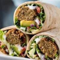 24. Falafel Wrap · A blend of garbanzo beans, mixed with spices and served with hummus, lettuce, tomatoes and t...