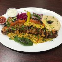 32. Lamb Shish Kebab · Tasty pieces of marinated lamb cubes, grilled with onion and bell peppers on skewers. Served...