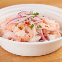 CEVICHE DE CAMARON · Fresh Shrimp marinated and cooked in Lime juice spiced
and served with peruvian corn, camote...