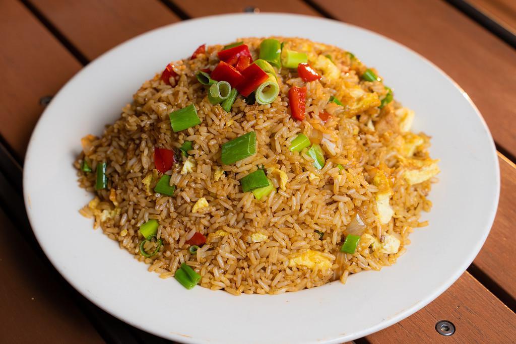 ARROZ CHAUFA · Peruvian fried rice with red bell peppers, scallions, garlic, soy sauce, scrambled eggs, and a dash of ginger
