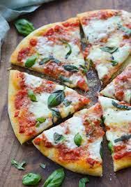 Artisanal Margharita Pizza · Tomatoes and mozzarella cheese.