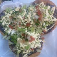 TOSTADAS CON CARNE (TOSTADAS WITH MEAT) · Flat corn tortilla topped with black beans, lettuce, cheese, cream, pico de gallo with your ...