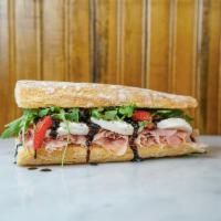 Cousin Cristina Sandwich · Prosciutto, Fresh Mozzarella, Extra Virgin Olive Oil, Balsamic Glaze and Roasted Red Peppers...