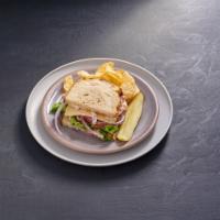 Turkey · Oven-roasted turkey, Havarti cheese, lettuce, tomato, red onion, and cranberry mayo on sourd...