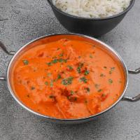 Butter Chicken · Clay oven baked chicken, cooked in rich tomato butter creamy sauce.