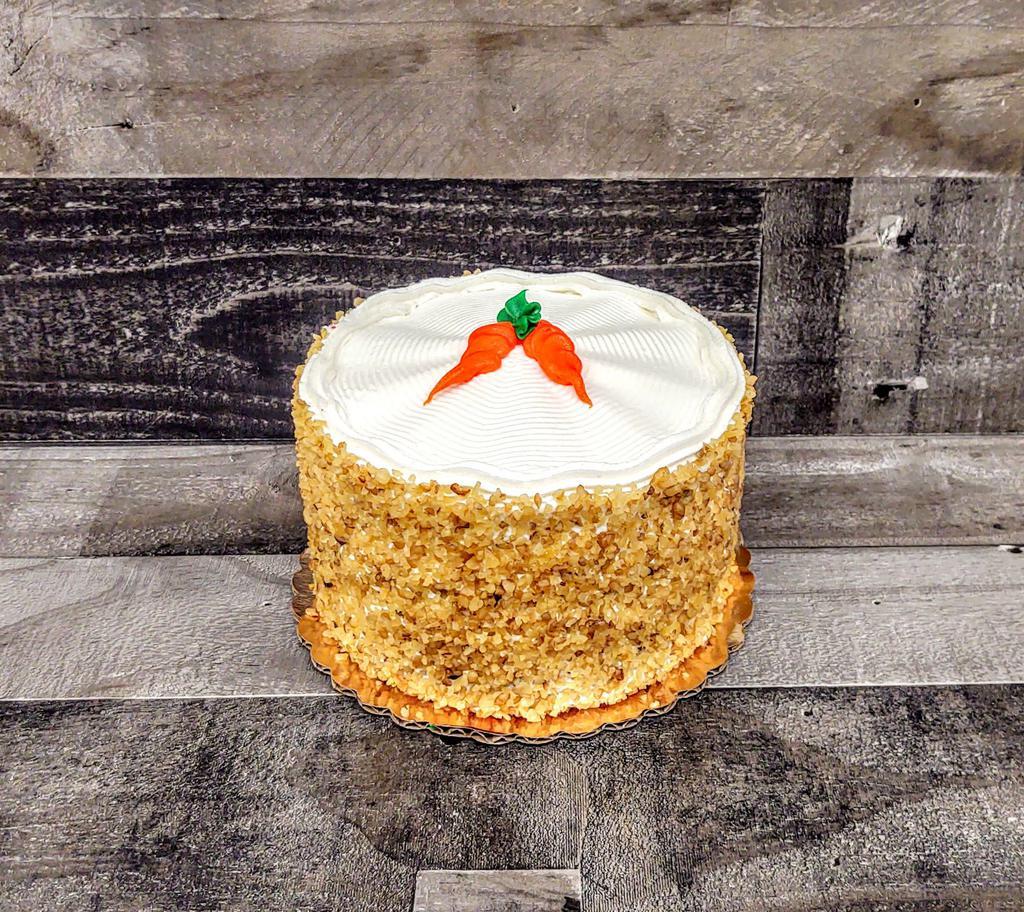 Carrot Cake · Carrot cake walnuts, raisins, coconuts, and cream cheese icing.