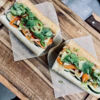 Miwich Vegan Banh Mi · Fresh baked baguette, vegan patty, pickled vegetables, cilantro, cucumber and sesame aioli s...