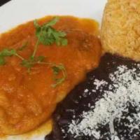 Chile Relleno con picadillo · Fire Roasted Poblano chile, chihuahua cheese & ground beef, coated w/ egg batter served w/ m...