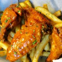 Tiger Wings · Seasoned and slow cooked then dropped in the fryer for the perfect amount of crisp tossed in...