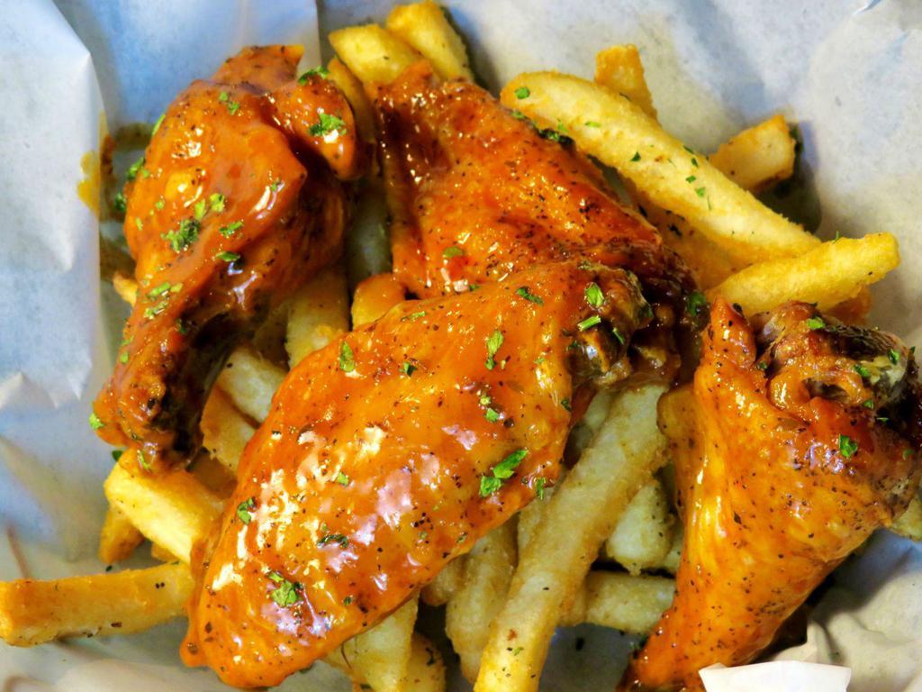 Tiger Wings · Seasoned and slow cooked then dropped in the fryer for the perfect amount of crisp tossed in your choice of sauce served with celery and a 1/2 order of the fries. Comes with choice of suace,