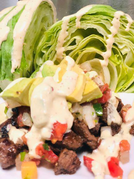 Chimo Wedge  · Marinated and blackened sirloin served with pico de gallo gallo, avocado covered in our delicious chimo sauce.
