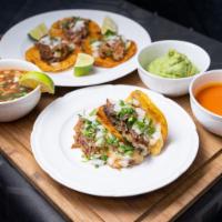 Los Primos DeLux Platter · 3 Birria tacos, 2 quesatacos, 1 consome, fresh onions ,cilantro limes, red salsa ＆ guacamole.