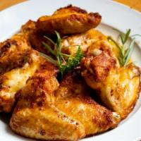 Wings · 10 pieces. Cooked wing of a chicken coated in sauce or seasoning.