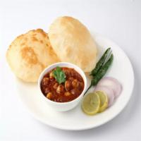 Chole Batura · Deep fried puffed bread made of all purpose flour served with chick peas curry.