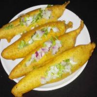 Andhra Mirchi · Deep fried Gram flour batterd Serrano chillies  and stuffed with onions, cilantro and chat m...