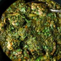 Saag Chicken · Chicken pieces cooked in medium spiced spinach gravy. Served with rice.