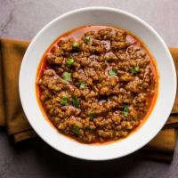 Lamb Kheema Masala · Ground lamb meat cooked in spicy Indian spices. Served with rice.
