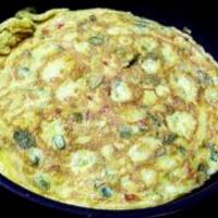 Omlette · A spicy omlette filled with onions, green chillies and herbs.