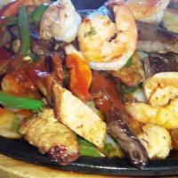 MIXED FAJITAS · Mixed fajitas contain beef, chicken, and shrimp. They are served with rice and beans. Or Fri...