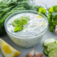 Cacik  · Zatziki. Finely chopped caby, cucumbers blended with garlic, yogurt mint, dill and olive oil. 