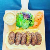 Falafel Dinner  · 6 pieces falafel served with humus, greens, tomatoes and tahini sauces.