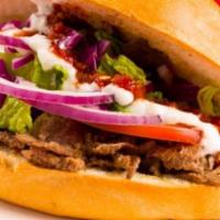 Doner Kebab with Fries · Sandwich with lettuce, pickled red cabbage, tomatoes, red onions and cucumber.