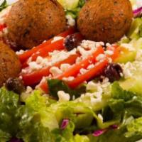 Falafel Kebab Vegetarian · Lettuce, tomatoes, red onions, pickled red cabbage, cucumber and 3 falafel balls stuffed in ...