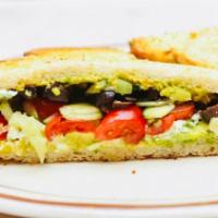 Greek Avocado Toast · Crumbled feta, mashed avocado, cherry tomatoes, chopped cucumbers, chopped Kalamata olives, ...
