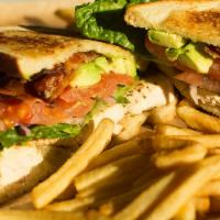 Clubhouse Sandwich · Grilled chicken breast, applewood bacon, avocado, lettuce, tomato, red onions, pesto, aioli,...