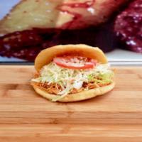 Arepas · *Veggie option*  Ground corn dough with choice of filling topped with cabbage, special sauce...