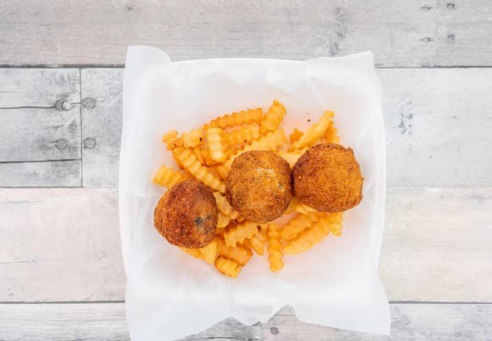 Boudin Balls Combo · Homemade boudin made with pork, rice and cajun spices then rolled and fried to a golden brown. 