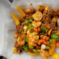 Swamp Fries · Sauteed shrimp, diced chicken and crawfish tails in a homemade cajun sauce over a jumbo bake...