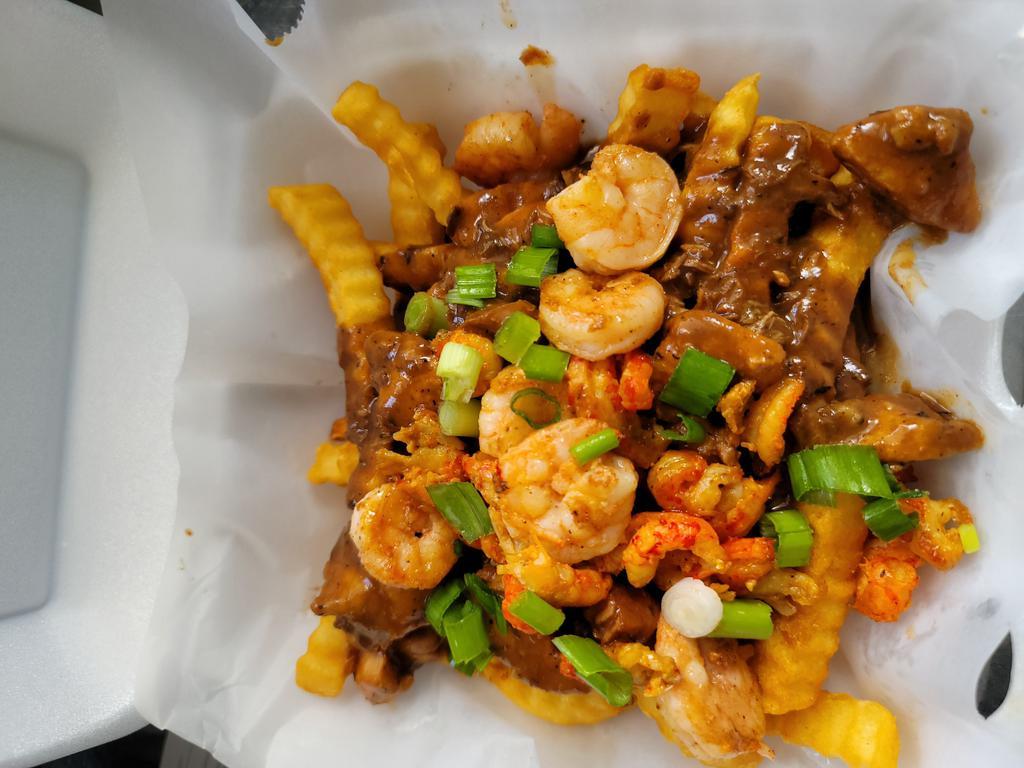 Swamp Fries · Sauteed shrimp, diced chicken and crawfish tails in a homemade cajun sauce over a jumbo baked potato with sliced scallions.