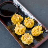 Mega Balls · 5 steamed or fried dumplings. A combination of ground shrimp and chicken in shiitake mushroo...
