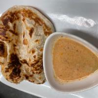 Roti Roti · Flat bread with a side of masaman curry.