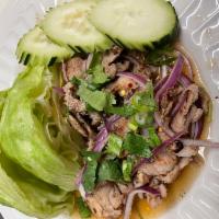 Pork Num Tok Salad · Spicy grilled pork salad with chili, shallots , scallions and cilantro