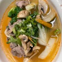 Tom Yum Noodle Soup · Rice noodle in Tom Yum soup with fresh mushrooms. Spicy.