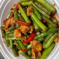 Pad Prik Khing · Sauteed chili paste and Thai spices with lime leaves, string beans and bell pepper. Served w...