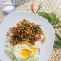 Minced Pork Basil Sauce Over Rice Entree · Traditional Thai basil sauce with onions, string bean and bell pepper