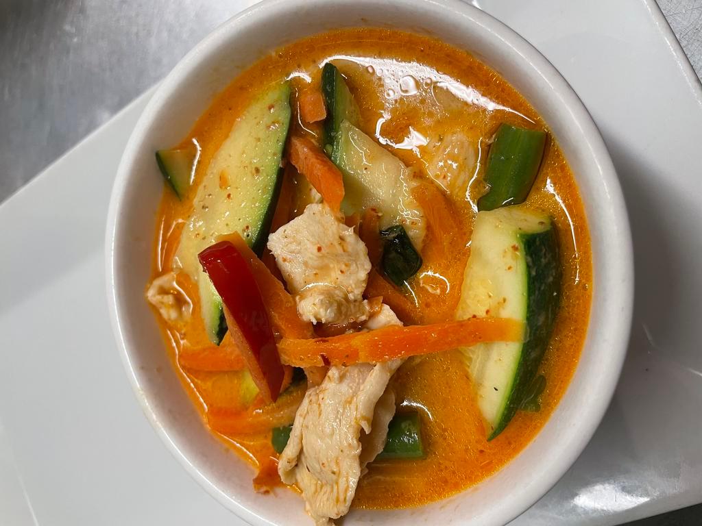 Panang Curry · Green bean, bell pepper, carrot, basil, coconut milk and lime leaf. Served with jasmine rice. Spicy.