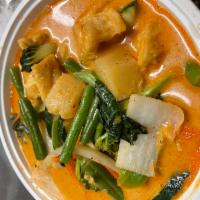 Coconut Pineapple Curry · Pineapple, coconut milk, string bean, onions, bell pepper and fresh basil. Served with jasmi...