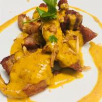 Malay Malay Chicken · Marinated chicken slightly fried and topped with yellow curry. Served with jasmine rice.