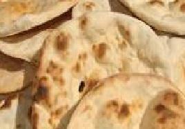 Tandoori Roti · Tandoori bread made of whole wheat. Baked fresh to order. Vegan. 
