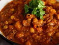 Channa Masala · Garbanzo beans in a delicately spiced masala sauce, cooked with tomatoes and spices. Served ...